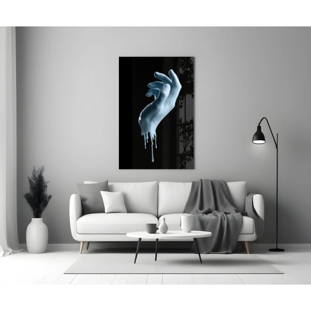 Striking dripping blue hand glass wall art canvas print on gray wall
