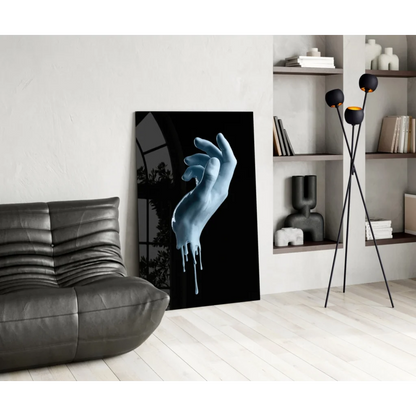 Striking dripping blue hand glass wall art canvas print in black frame