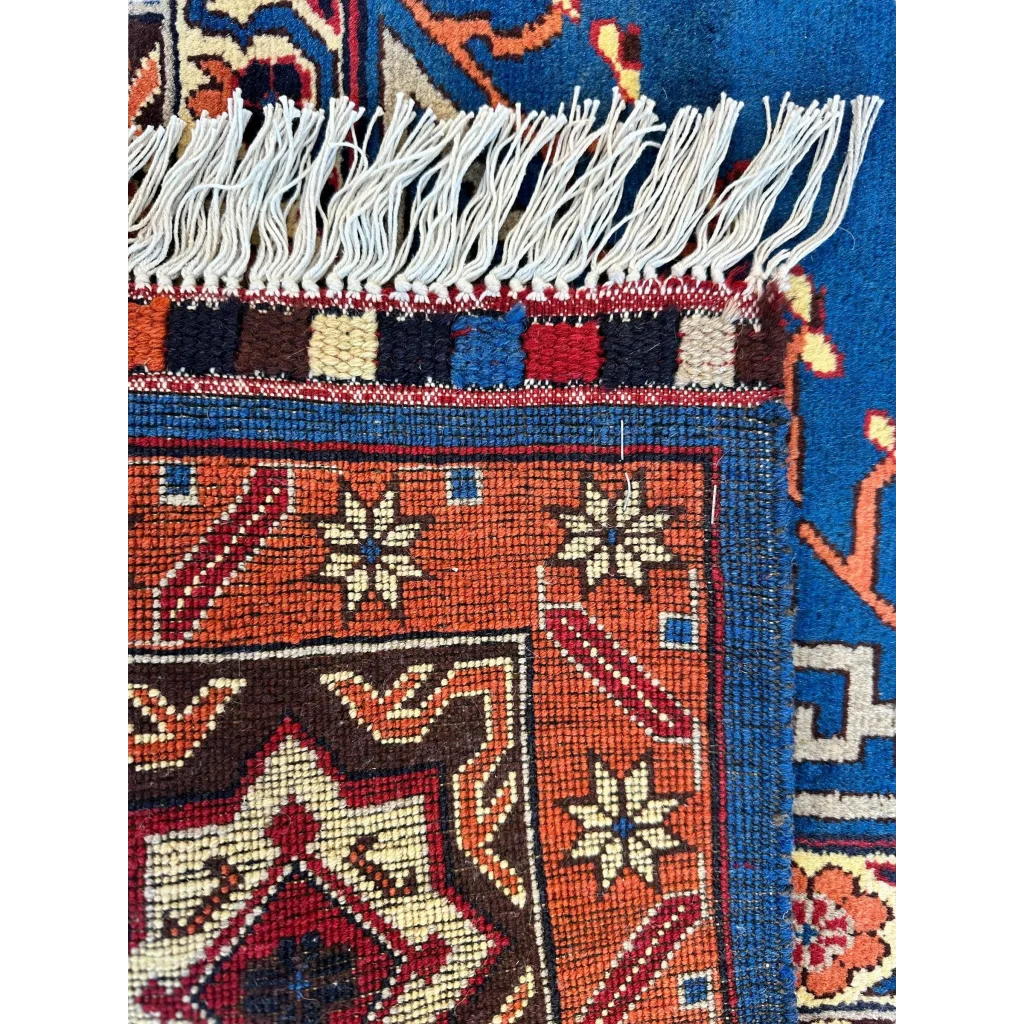 Vibrant orange and blue hand-knotted Afghan Kazak rug with geometric design