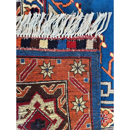 Vibrant orange and blue hand-knotted Afghan Kazak rug with geometric design