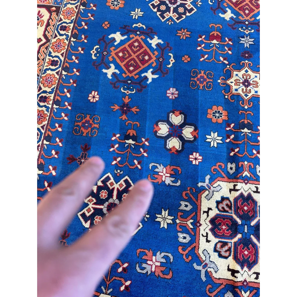 Vibrant blue hand-knotted Afghan Kazak rug with geometric design