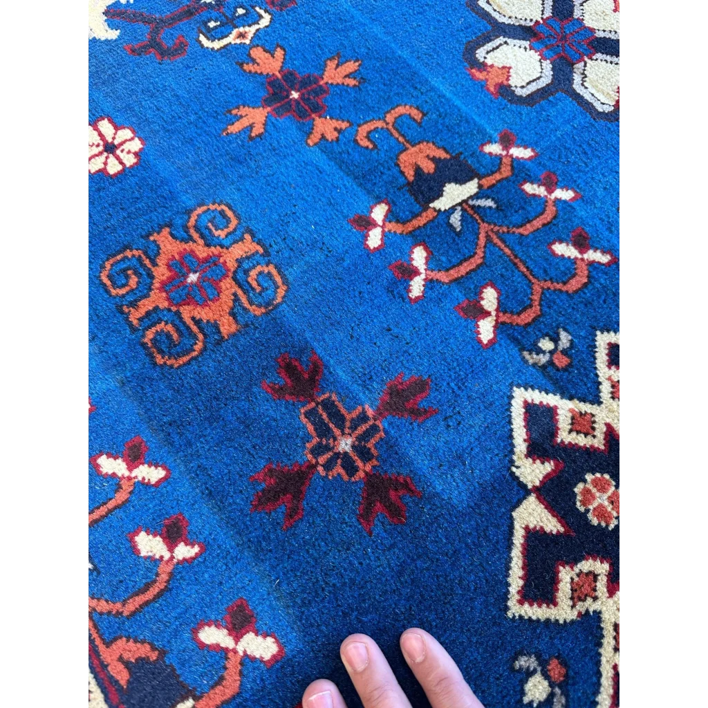 Vibrant blue wool hand-knotted Afghan Kazak rug with geometric design