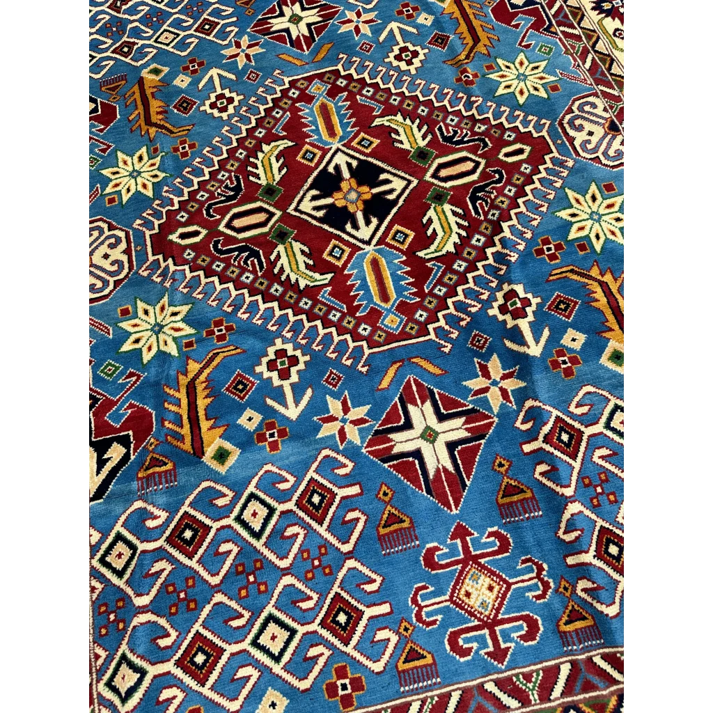 Vibrant blue Hand Knotted Afghan Kazak rug with cotton foundation and geometric floral patterns