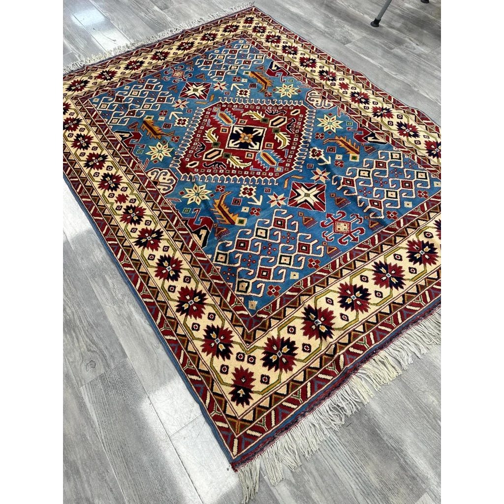 Vibrant blue red geometric Afghan Kazak rug on cotton foundation