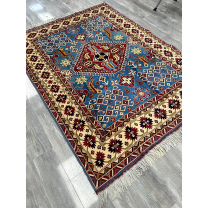 Vibrant blue red geometric Afghan Kazak rug on cotton foundation
