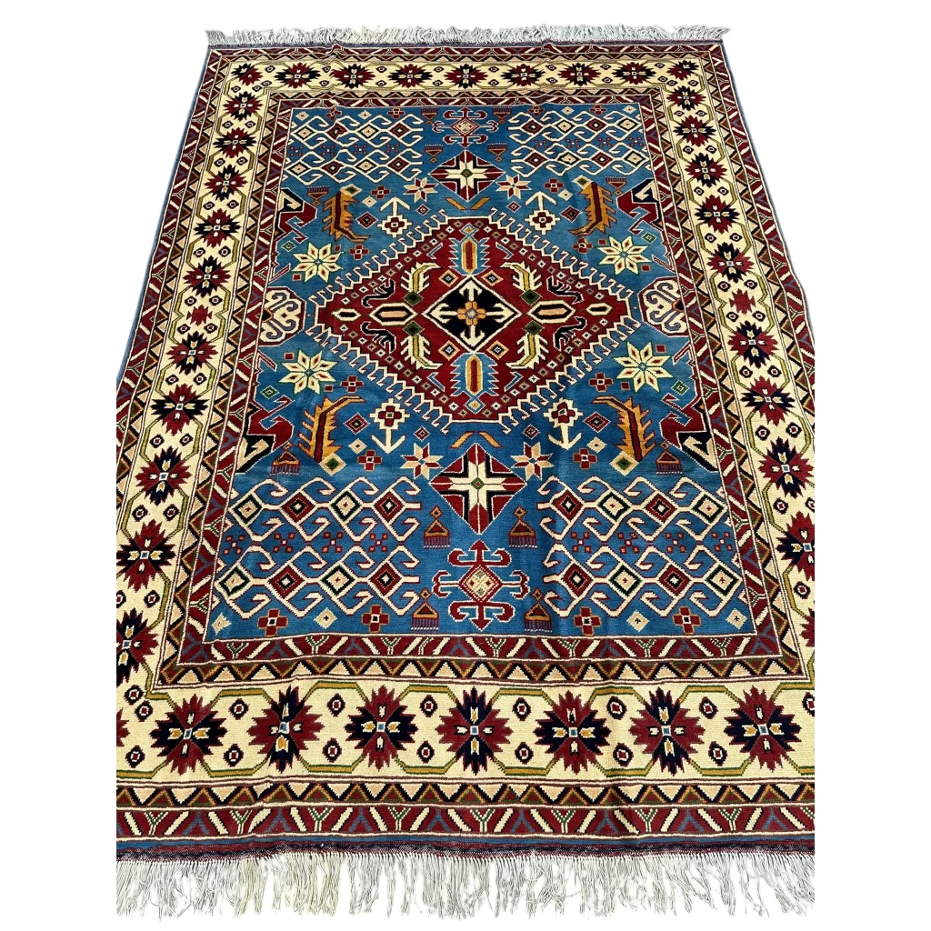 Blue and red geometric Kazak rug with cotton foundation and cream fringe