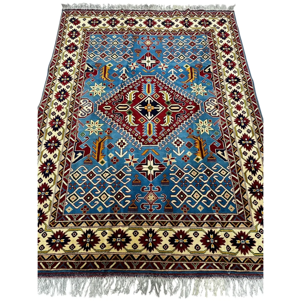 Blue and red geometric Kazak rug with cotton foundation and fringed edges