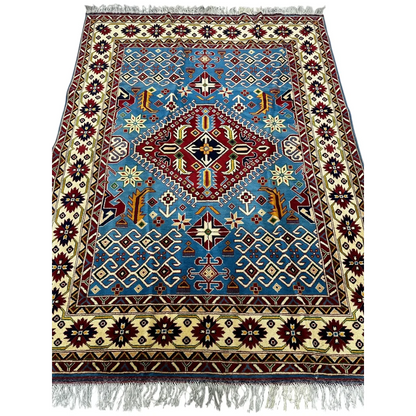 Blue and red geometric Kazak rug with cotton foundation and fringed edges