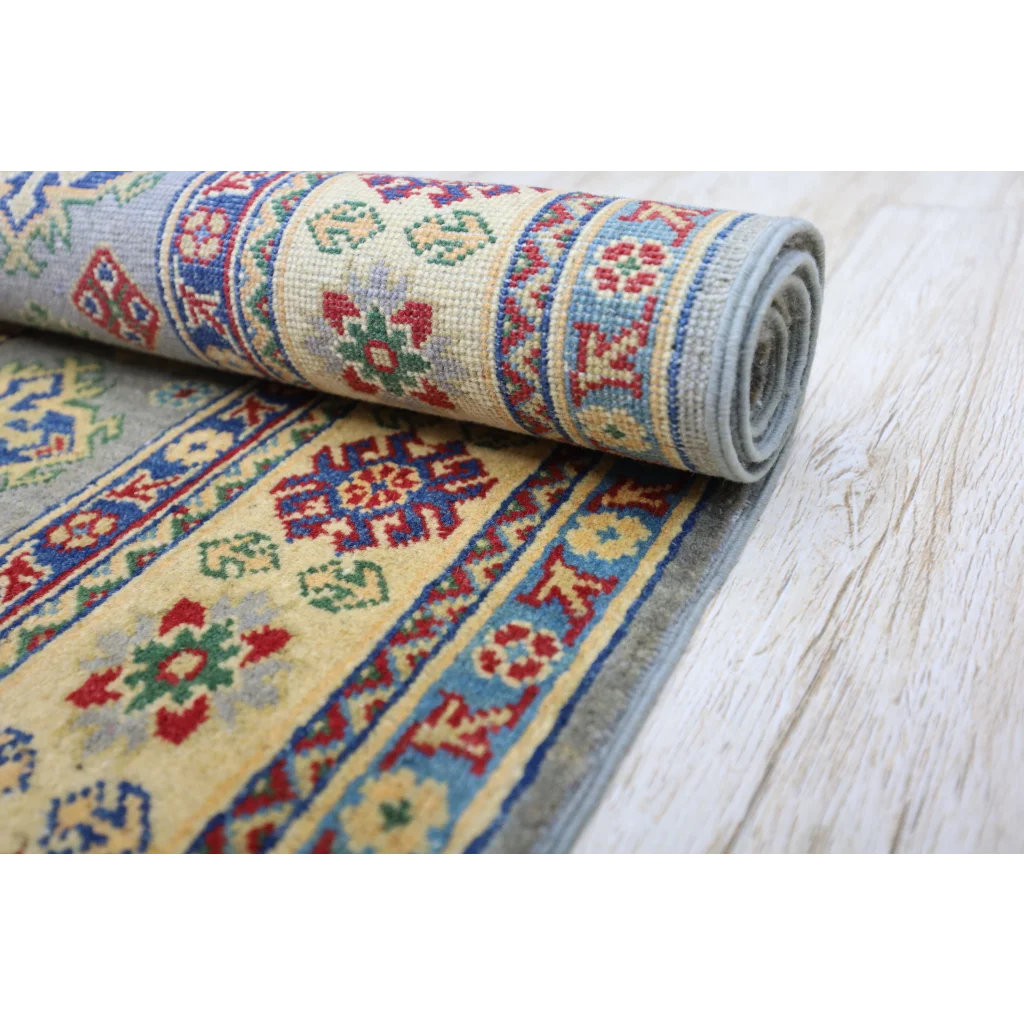 Hand-knotted Afghan Kazak wool rug with cotton foundation, rolled, intricate patterns