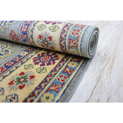 Hand-knotted Afghan Kazak wool rug with cotton foundation, rolled, intricate patterns