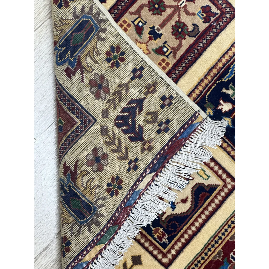 Afghan Bakhteiari hand-knotted rug in cream with navy floral geometric panels on cotton foundation