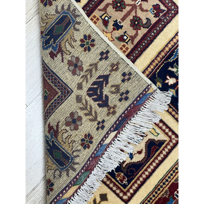 Afghan Bakhteiari hand-knotted rug in cream with navy floral geometric panels on cotton foundation