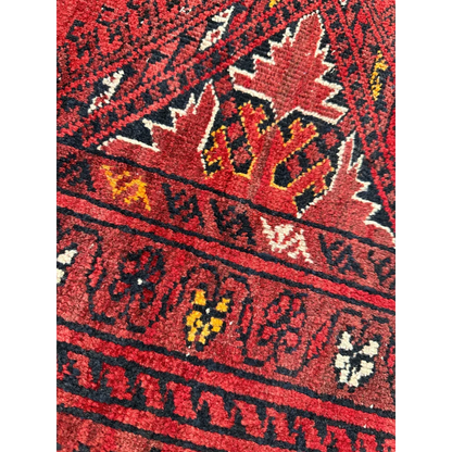 Vibrant Afghan Turkoman Waziri wool rug with red, black, yellow patterns