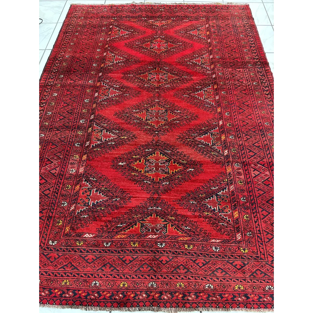Vintage Afghan Turkoman Waziri wool rug in red with intricate motifs