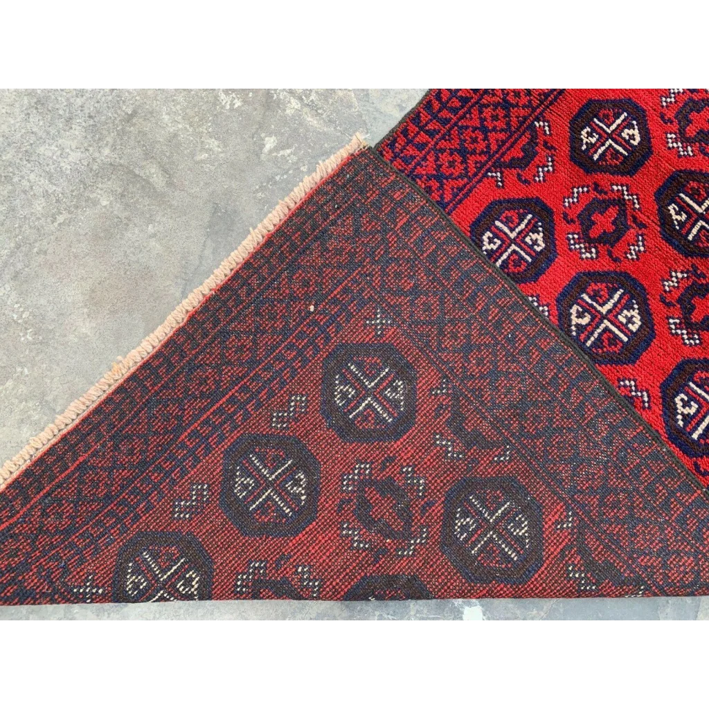 Hand-knotted Afghan Baluch wool runner with red and blue geometric patterning