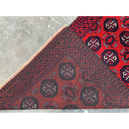 Hand-knotted Afghan Baluch wool runner with red and blue geometric patterning