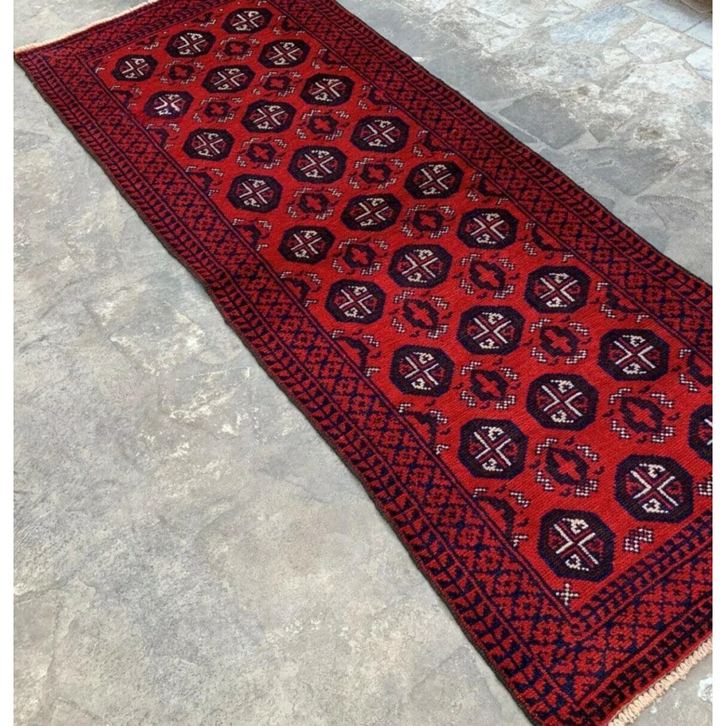 Vibrant red and navy Afghan Baluch hand-knotted wool runner with geometric patterns