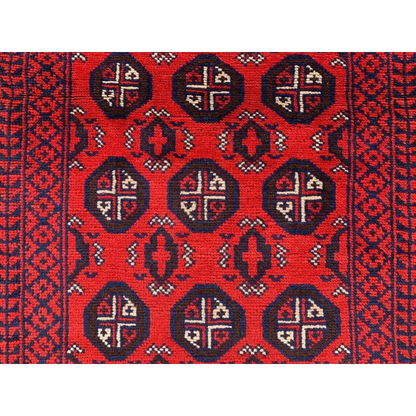 Vibrant red Afghan Baluch hand-knotted runner with navy blue and cream geometric patterns