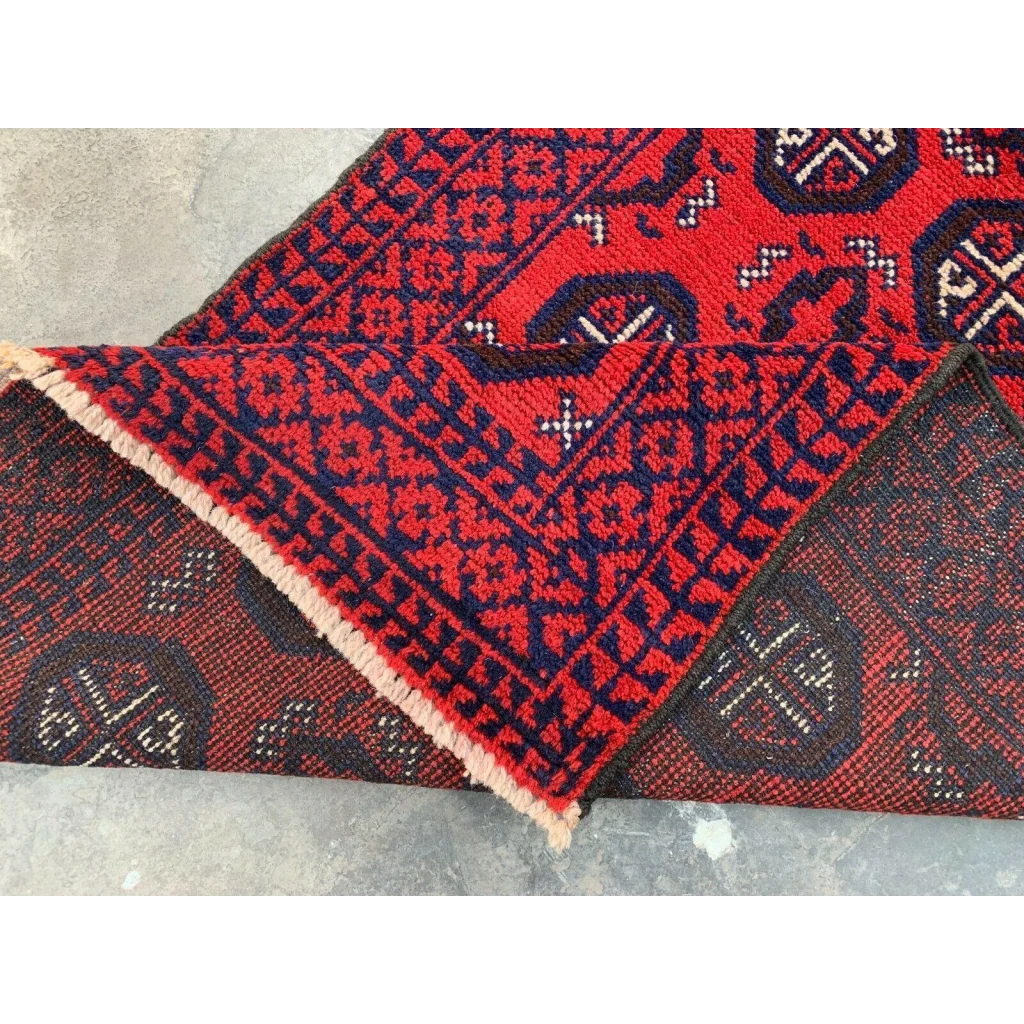 Hand-knotted Afghan Baluch wool runner with red and navy geometric patterns