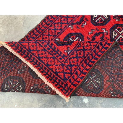 Hand-knotted Afghan Baluch wool runner with red and navy geometric patterns