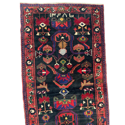 Dark blue Persian tribal Hamadan runner rug with red geometric patterns