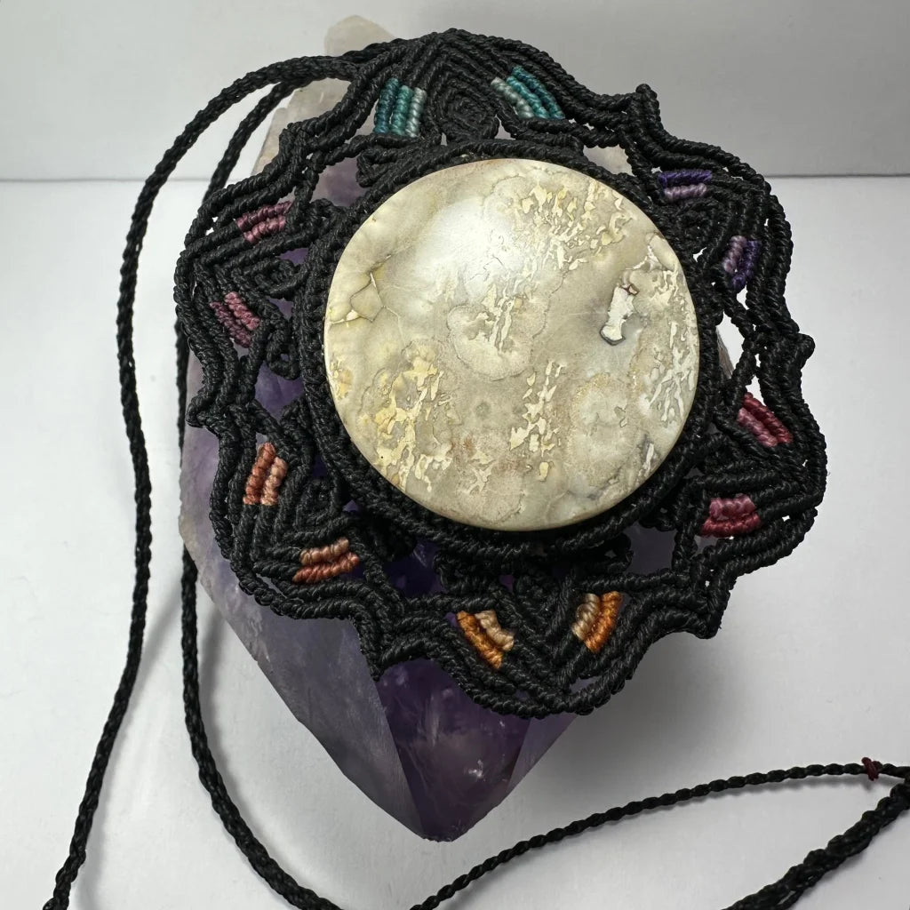 Hand woven flower necklace with jasper cabochon in black macrame frame