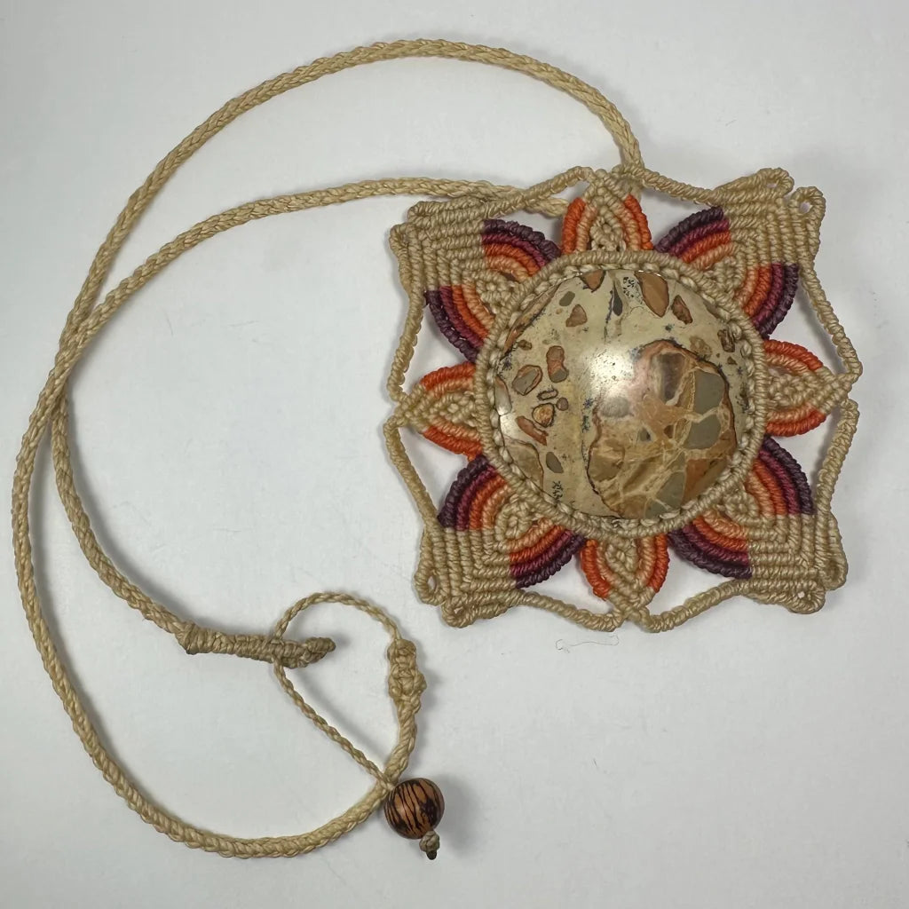 Hand woven flower necklace with jasper cabochon and macrame petals