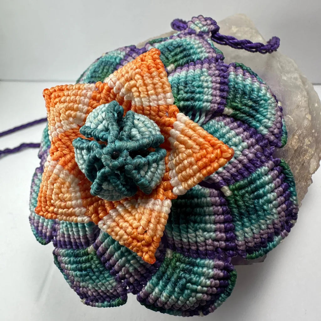 Hand woven flower necklace with vibrant macrame blooms