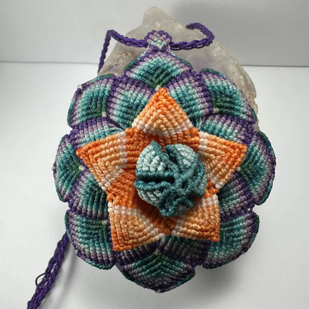 Hand woven flower necklace with vibrant macrame blooms