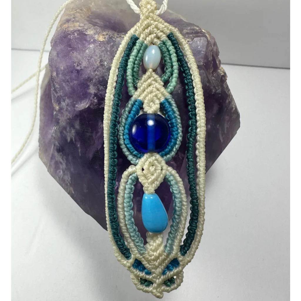 Handcrafted macrame necklace with teal cords and turquoise glass beads