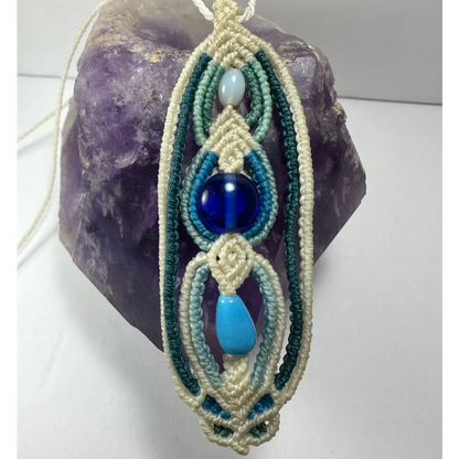 Handcrafted macrame necklace with teal cords and turquoise glass beads