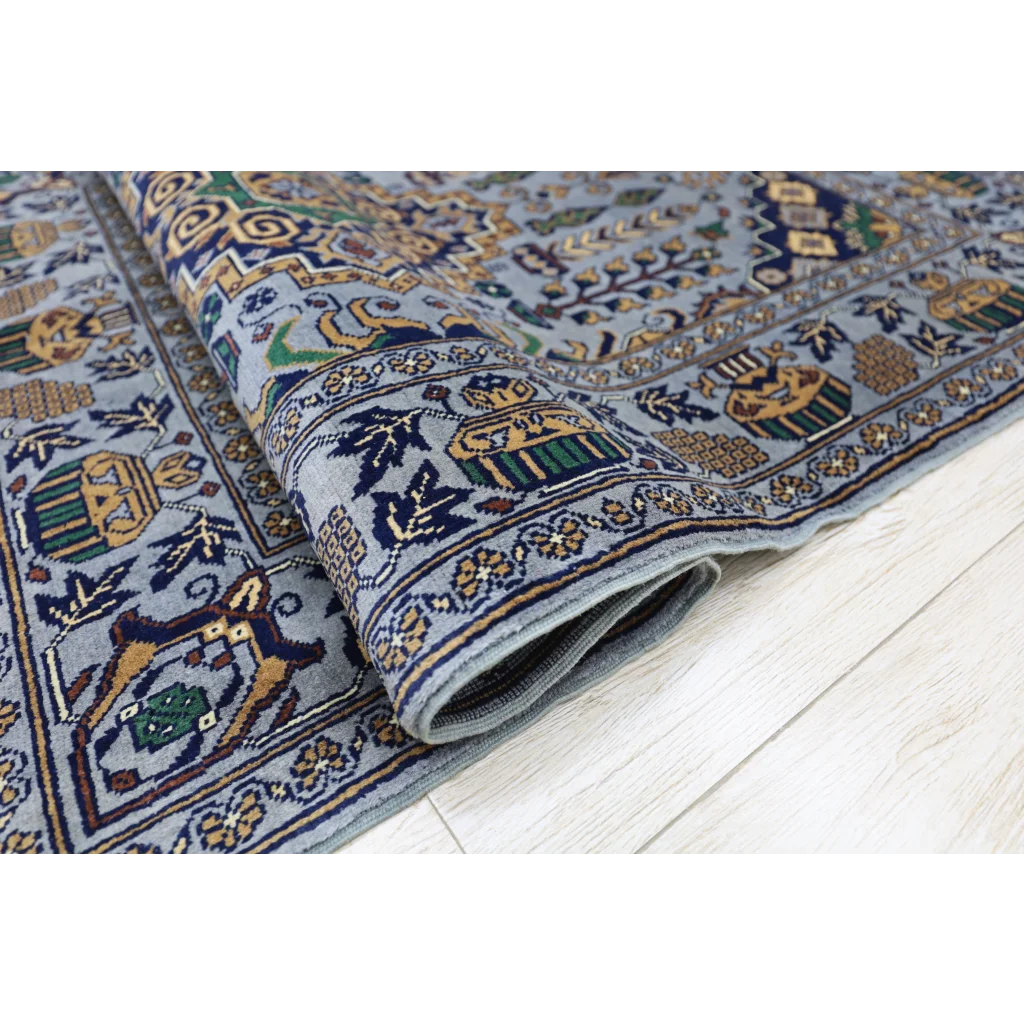 Handmade Afghan Zerkhaki rug in light blue with gold motifs on cotton foundation