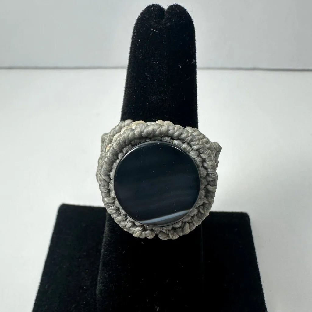 Chunky handmade woven ring with textured macrame band and dark onyx stone