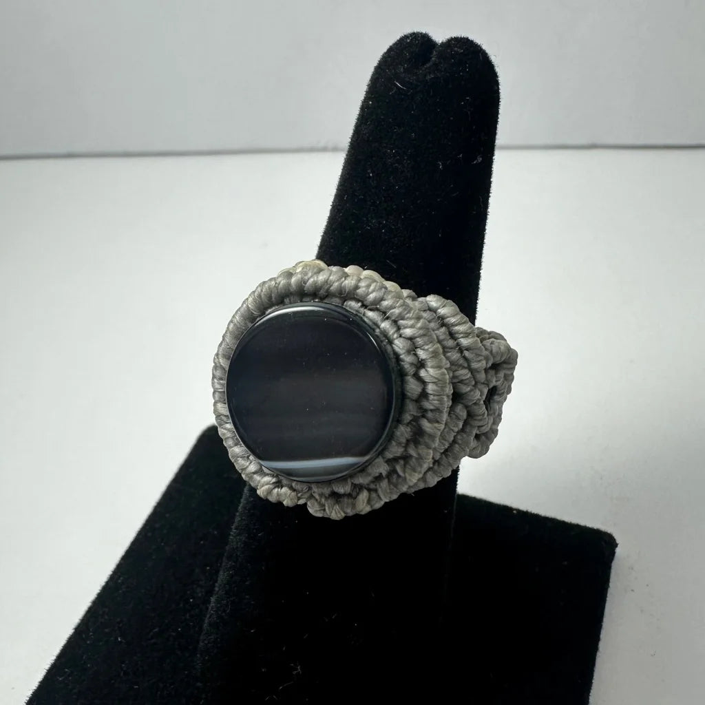 Handmade woven ring with gray macrame and dark oval stone