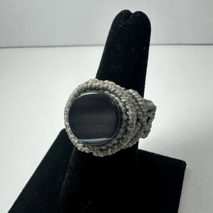 Handmade woven ring with gray macrame and dark oval stone