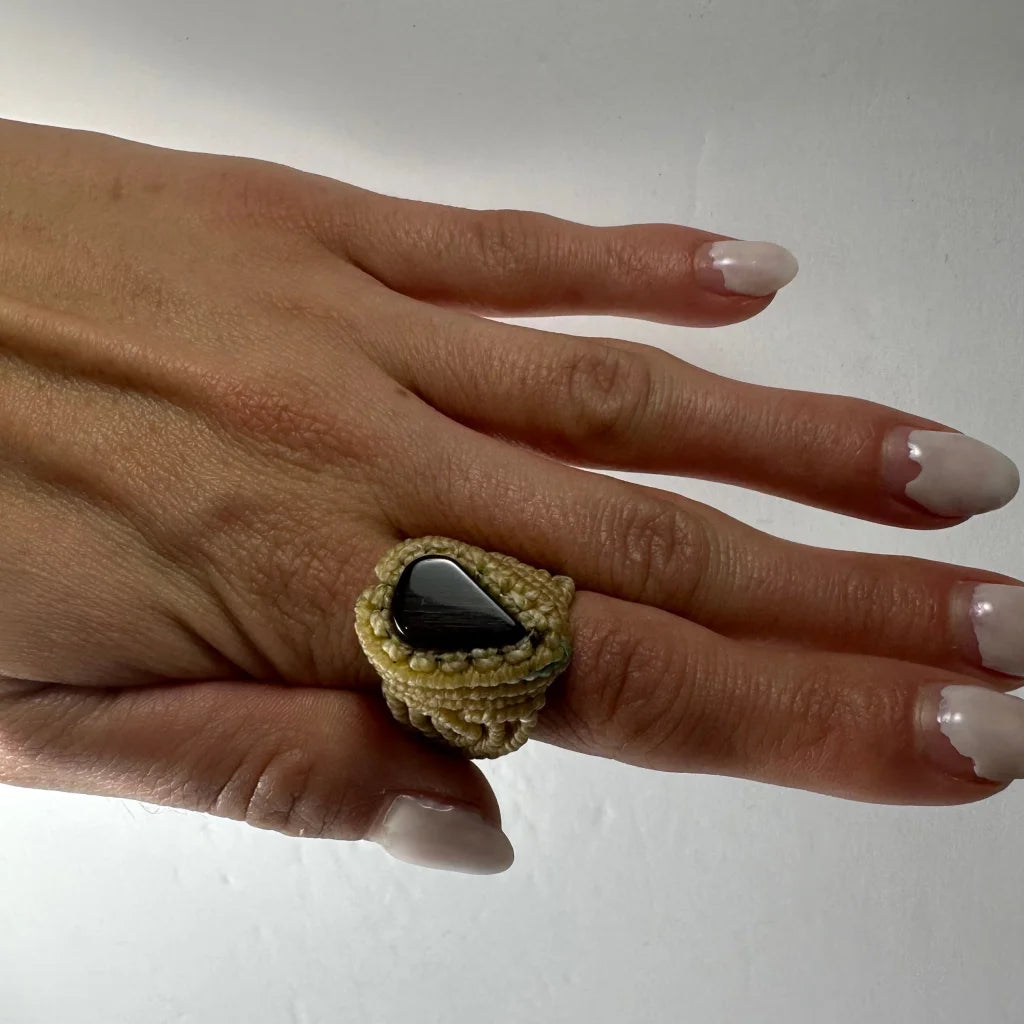 Handmade woven ring with olive green black cord and teardrop onyx stone