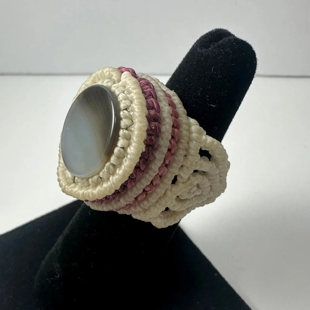 Handmade woven ring with oval gray stone in macrame cord band