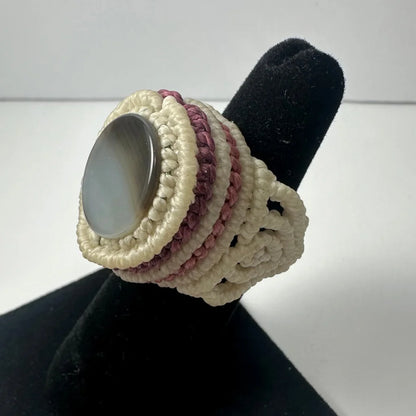 Handmade woven ring with oval gray stone in macrame cord band