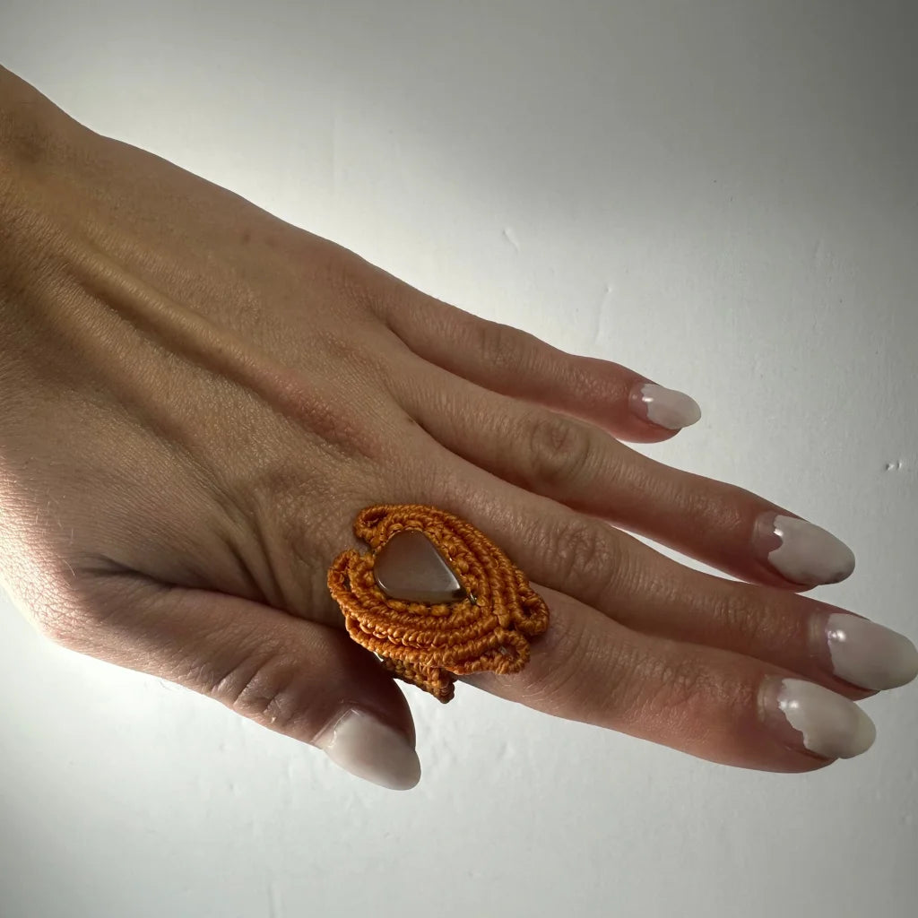Handmade woven ring in orange macrame with openwork design