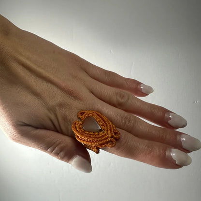 Handmade woven ring in orange macrame with openwork design