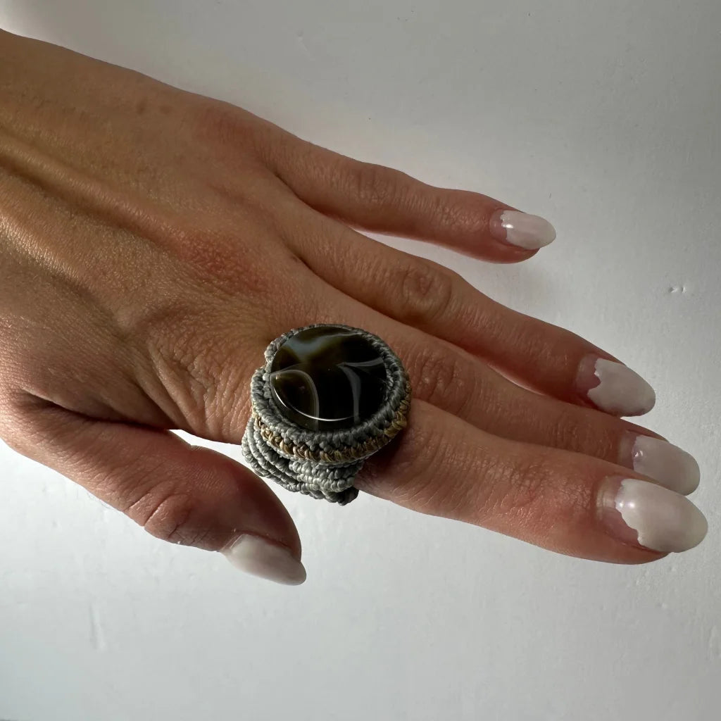 Handmade woven ring with dark swirling agate in gray macrame