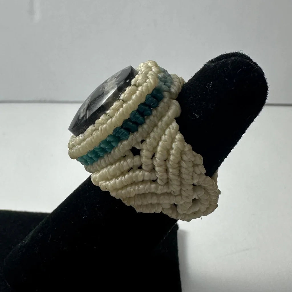 Handmade woven ring with dark polished stone and cream teal cords