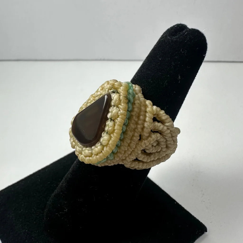 Handmade woven ring with dark brown teardrop stone in macrame band