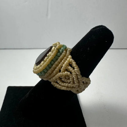 Handmade woven ring with dark oval stone in beige green beads