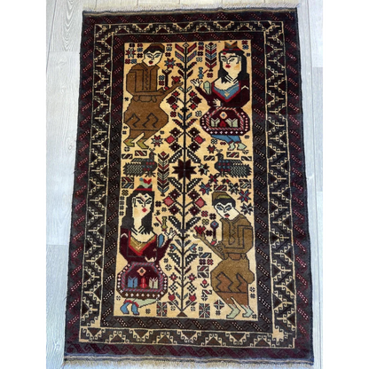 Beige and burgundy hand-knotted rug with stylized geometric figures in earth tones