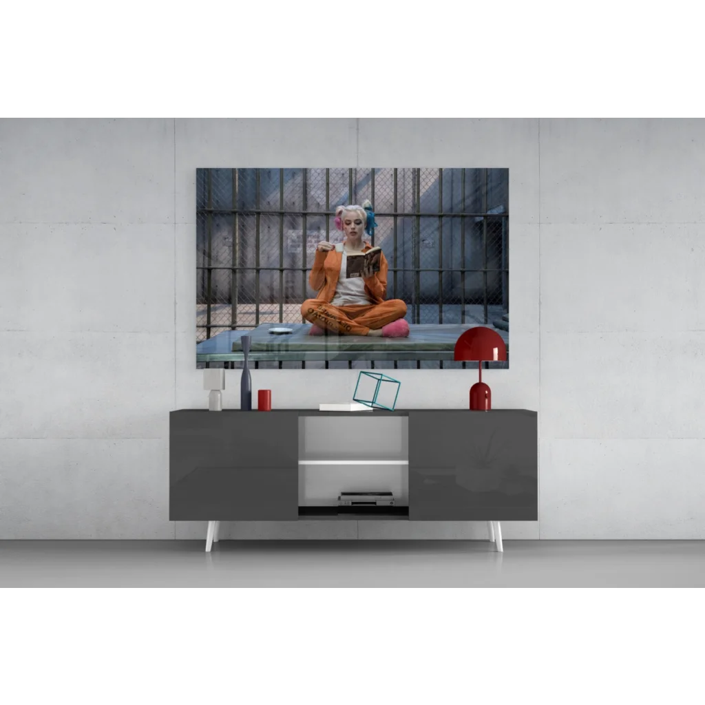 Harley Quinn in orange prison jumpsuit reading behind bars, canvas wall art print