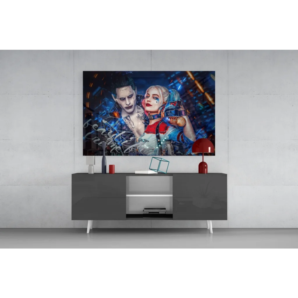 Vibrant Joker and Harley Quinn glass wall art on black console