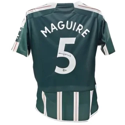 Dark green and white striped Harry Maguire signed Manchester United away jersey with number 5