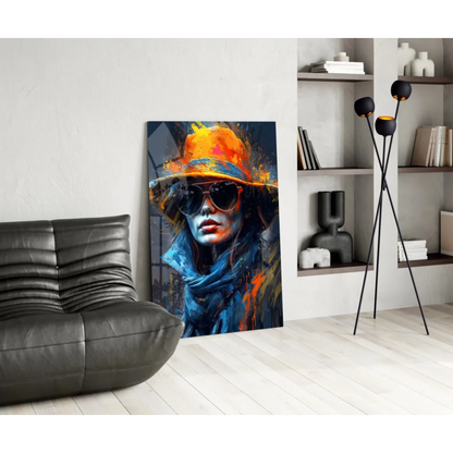Vibrant abstract woman canvas wall art in orange hat, sunglasses, bold blue strokes