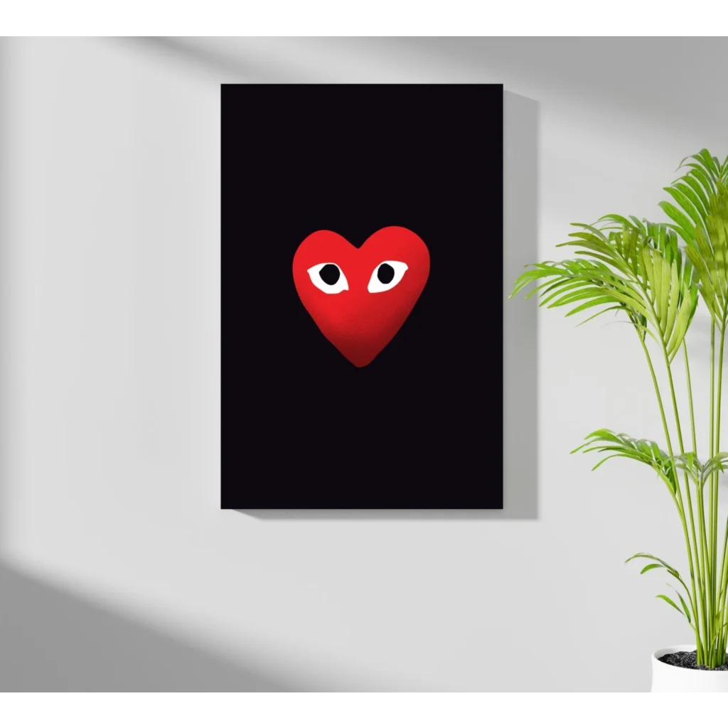 Comme des Garçons heart insigne aluminum print with red heart and white eyes
